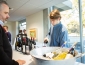 Catering staff member pouring a glass of wine 