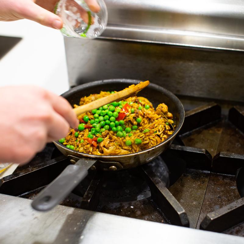 vegetable and rice mixture being stirred
