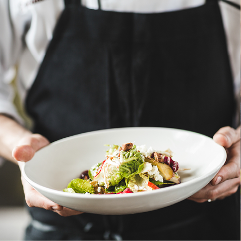 Salad on plate with wood background 