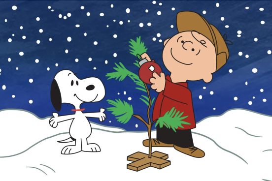 Char and snoopy setting up a christmas tree