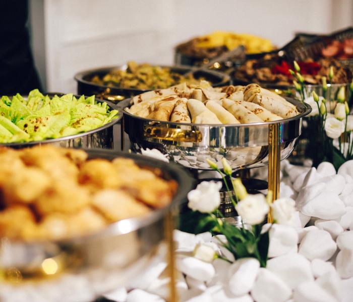 Catering setup with food in trays