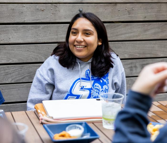 student wearing ssu shirt
