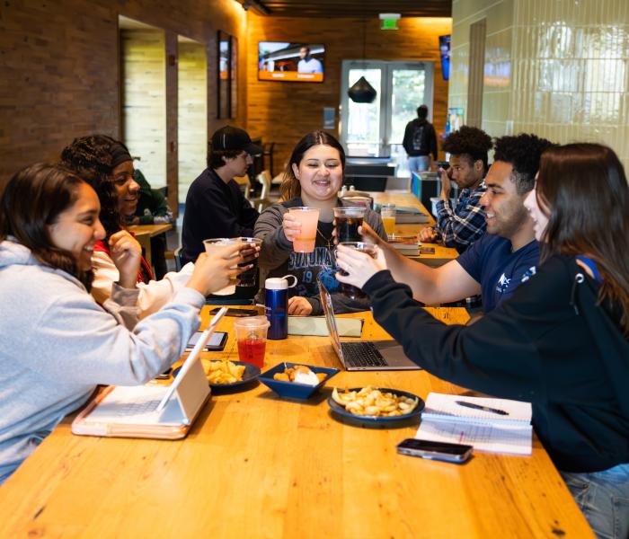 Student club celebrating a fundraiser at Lobos