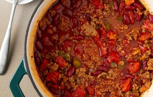 Chili in a bowl with meat, beans and pepper