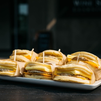 6 breakfast sandwiches on a platter from Charlie Brown's Cafe 