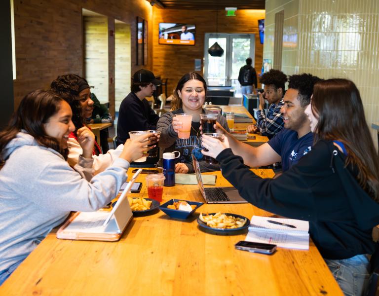 Student club celebrating a fundraiser at Lobos