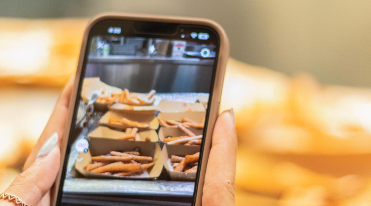 Taking a photo on a phone of the food