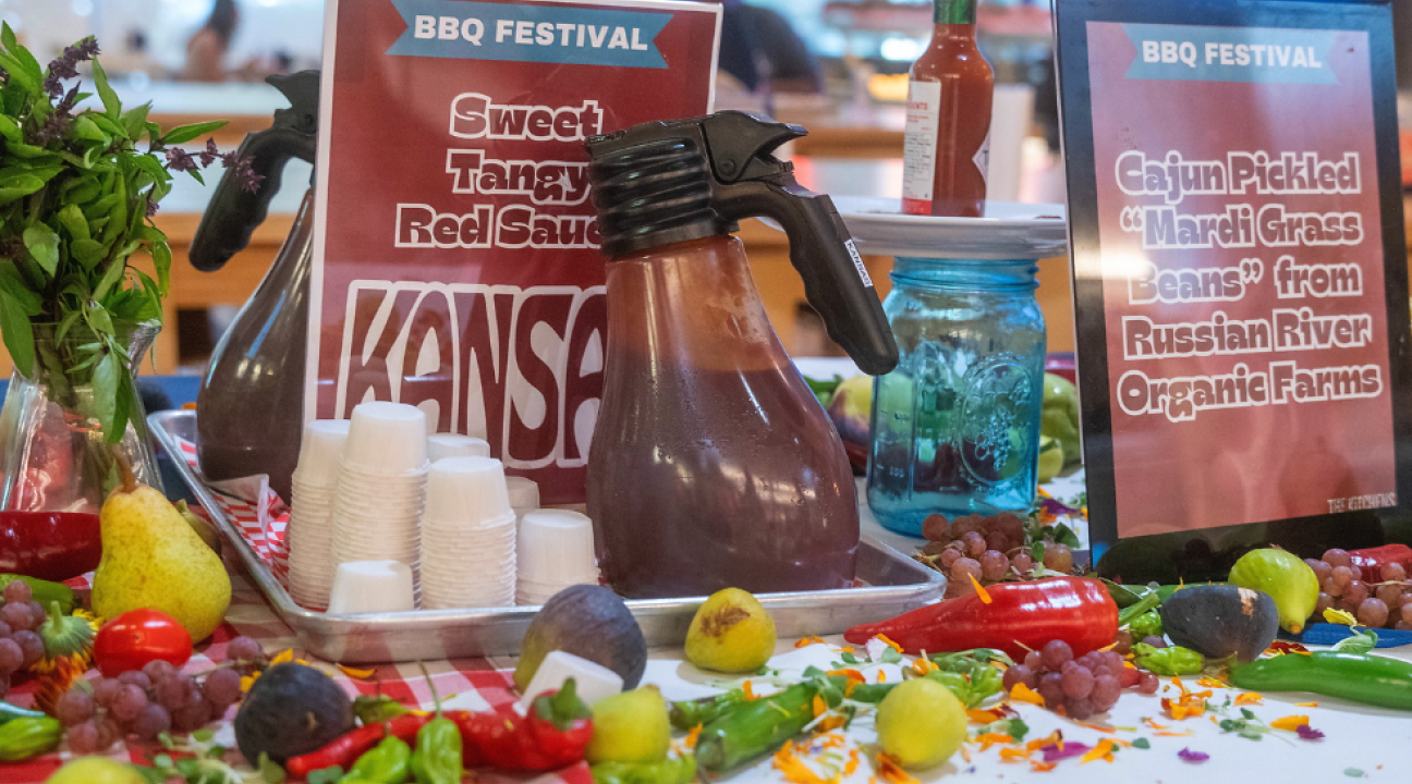 bbq sauce bar with cups and signage