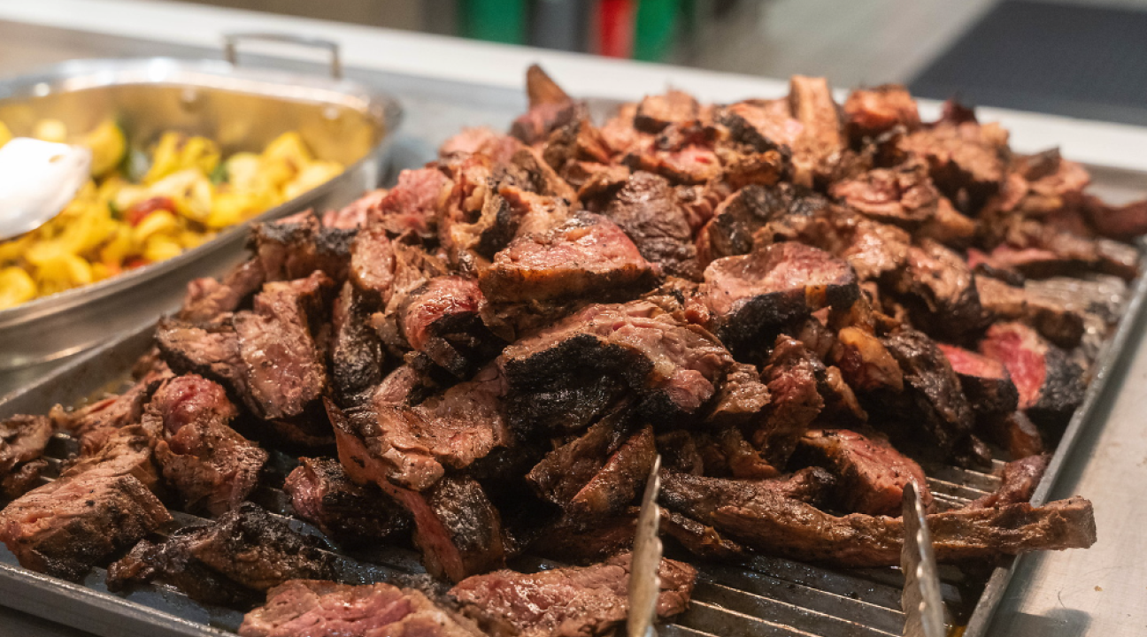 a tray of grilled meat