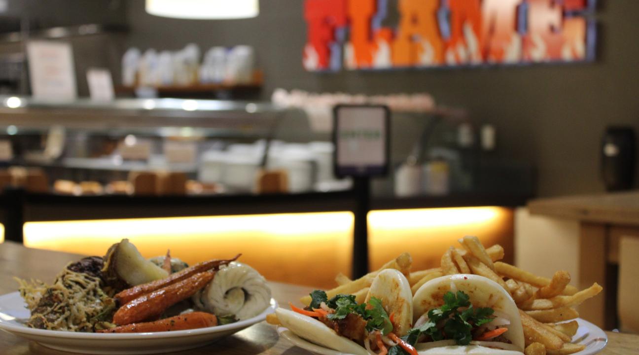 Tacos with Flame logo in the background