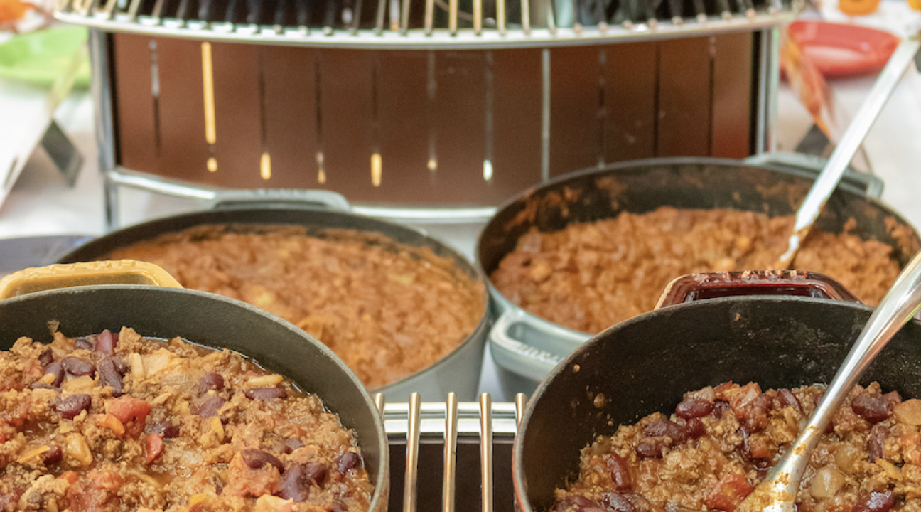 six bowls of chili on a tiered table