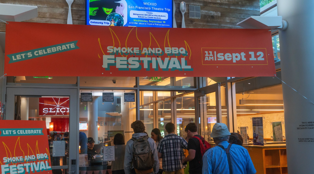 entrance to venue with orange event banner