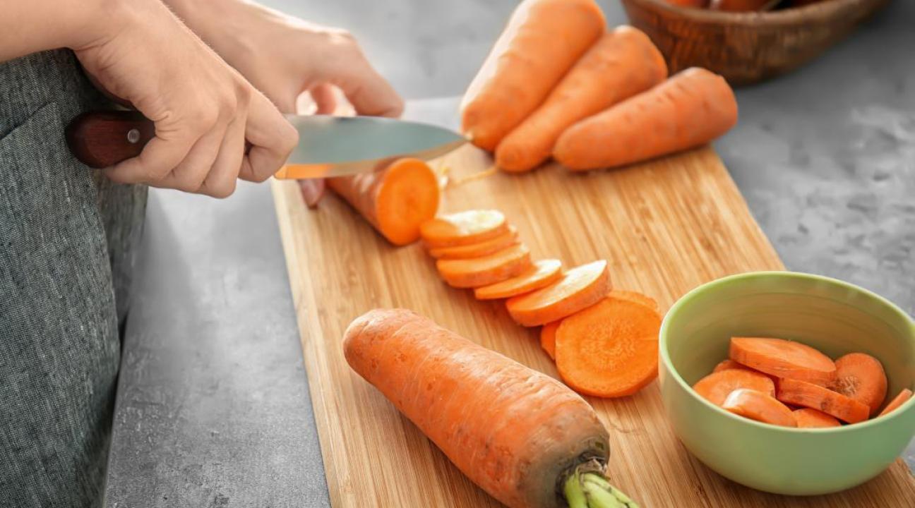knife cutting carrots 