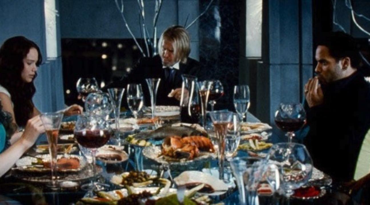 a table filled with plates of food and wine glasses