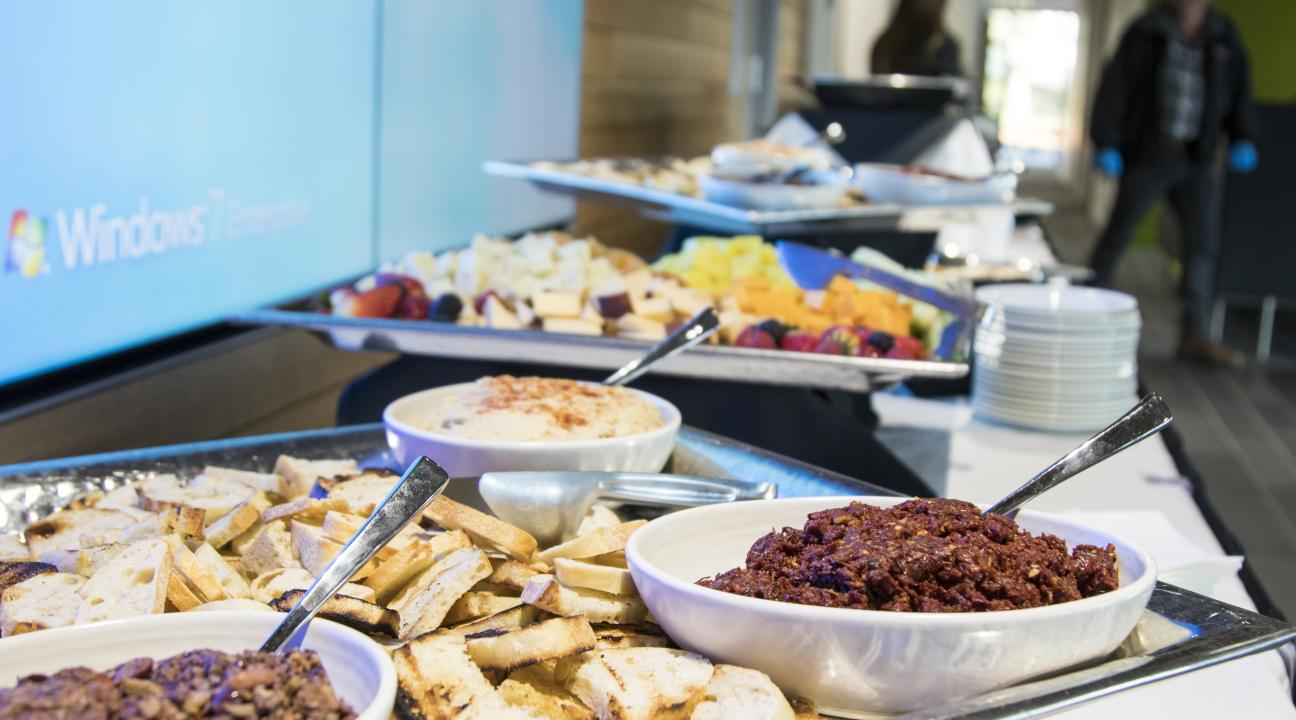 Catering setup of appetizers of bread and olive tapenade 