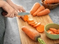 knife cutting carrots 