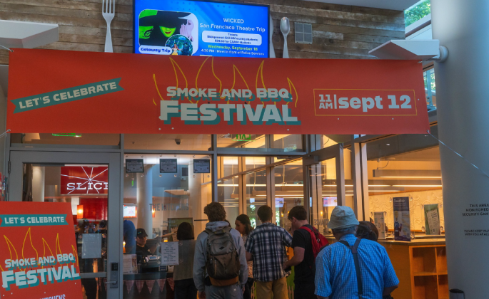 entrance to venue with orange event banner