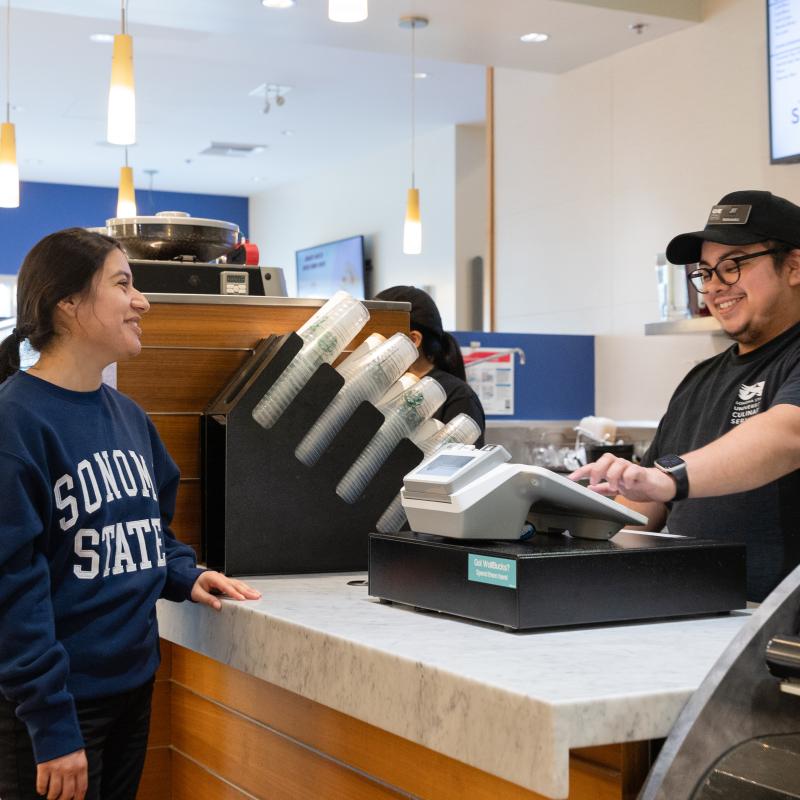 Student ordering at the counter with a cashier