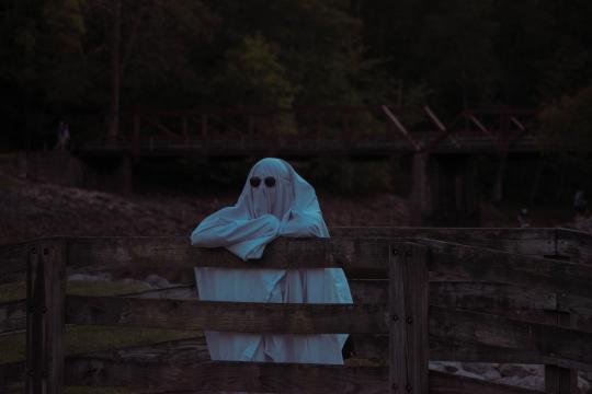 Person with sheet over them like a ghost