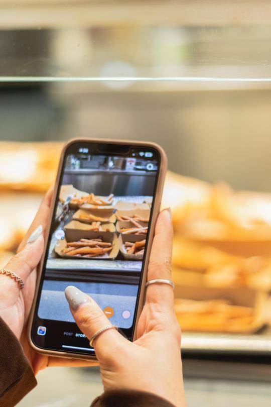 Taking a photo on a phone of the food