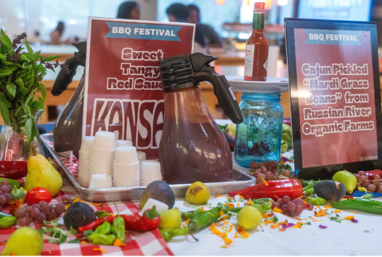 bbq sauce bar with cups and signage