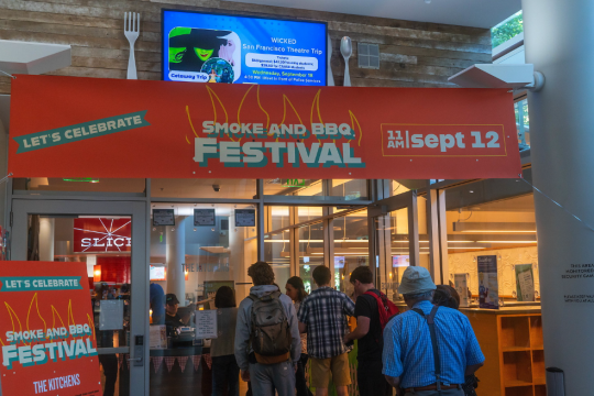 entrance to venue with orange event banner