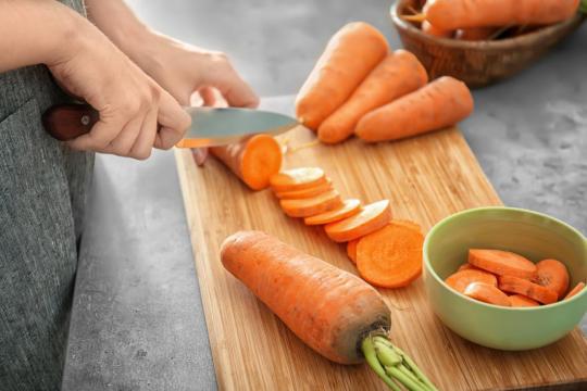 knife cutting carrots 