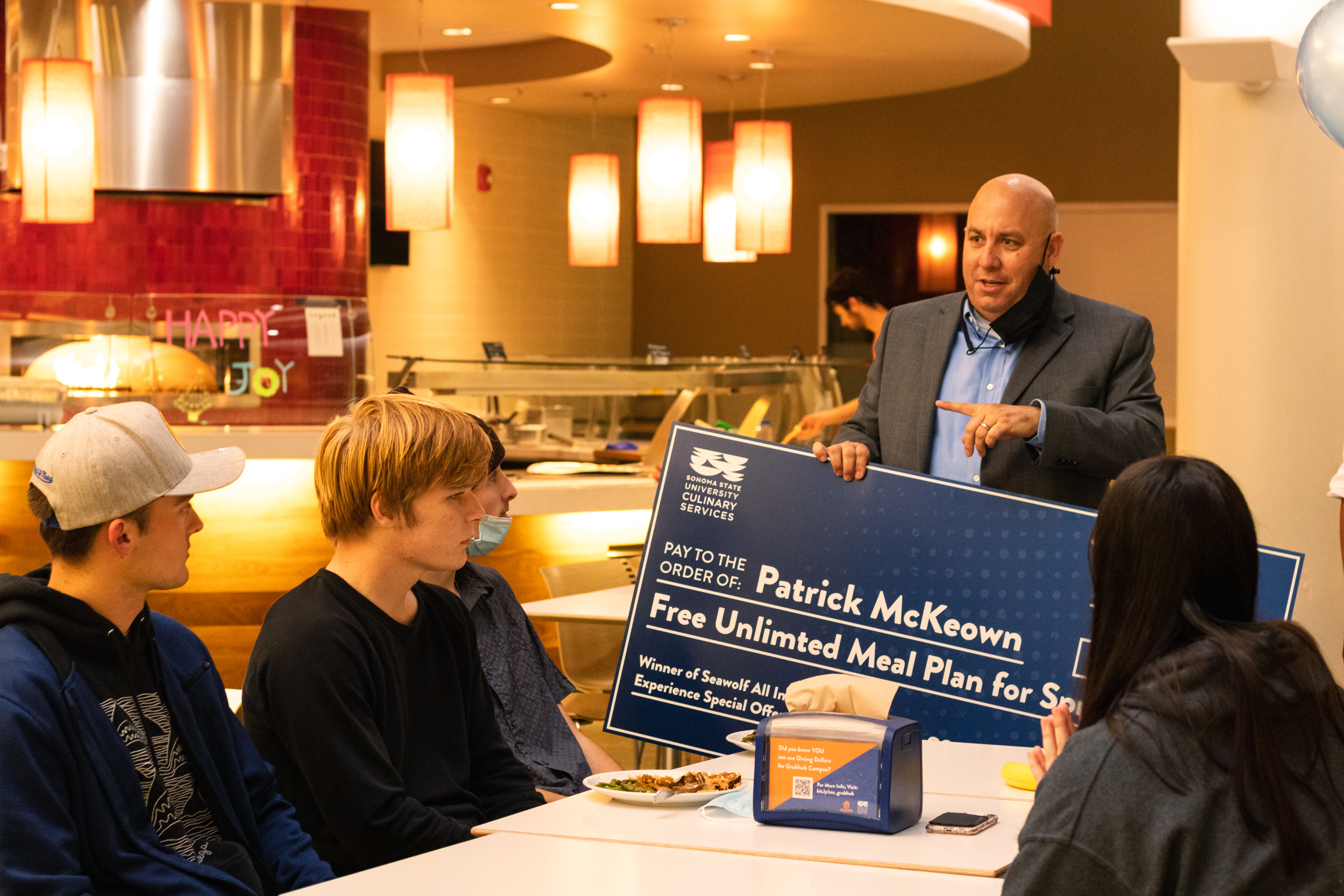 chatting with students at the kitchens