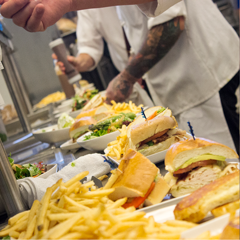someone making burgers